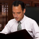 Illustration for article titled Reince Priebus Smiles, Shakes Head While Flipping Through Old Briefing On GOP’s Plans For 2016